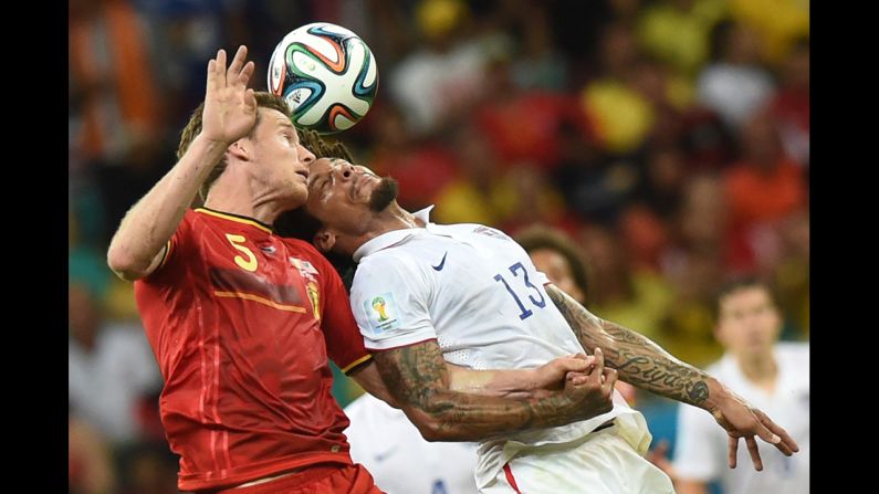 Belgian defender Jan Vertonghen, left, goes for the ball against U.S. midfielder Jermaine Jones.