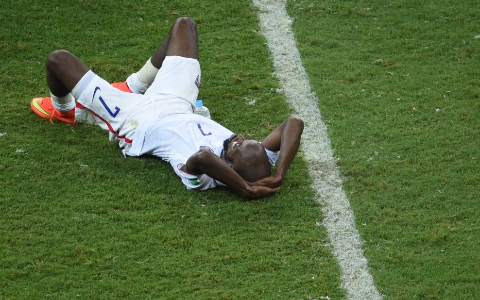 U.S. defender DaMarcus Beasley lies on the ground after the match.