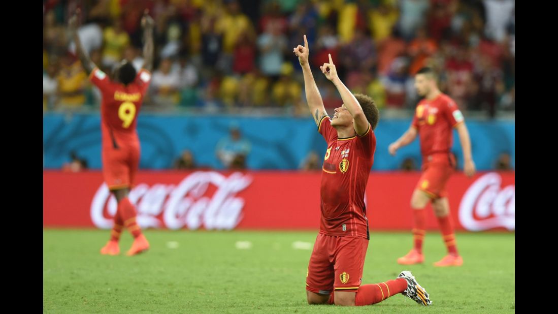 Belgian midfielder Axel Witsel, foreground, celebrates his team's victory.