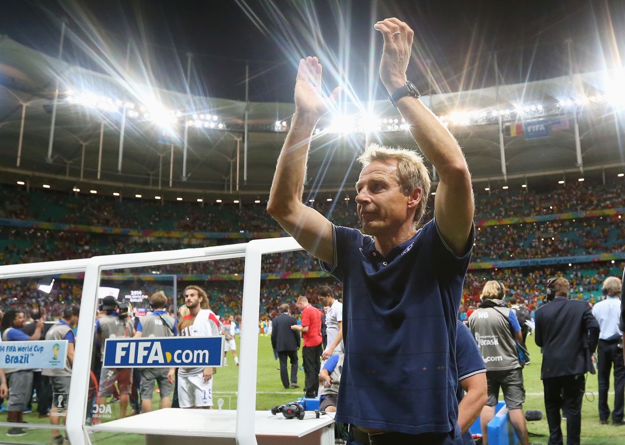United States head coach Jurgen Klinsmann applauds the fans after losing to Belgium in a World Cup round-of-16 match Tuesday, July 1, in Salvador, Brazil. Belgium won 2-1 in extra time to advance to the quarterfinals of the soccer tournament. The United States is out of the competition.