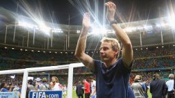 SALVADOR, BRAZIL - JULY 01: Head coach Jurgen Klinsmann of the United States applauds the fans after losing the 2014 FIFA World Cup Brazil Round of 16 match between Belgium and USA at Arena Fonte Nova on July 1, 2014 in Salvador, Brazil. (Photo by Alex Livesey/FIFA/Getty Images)