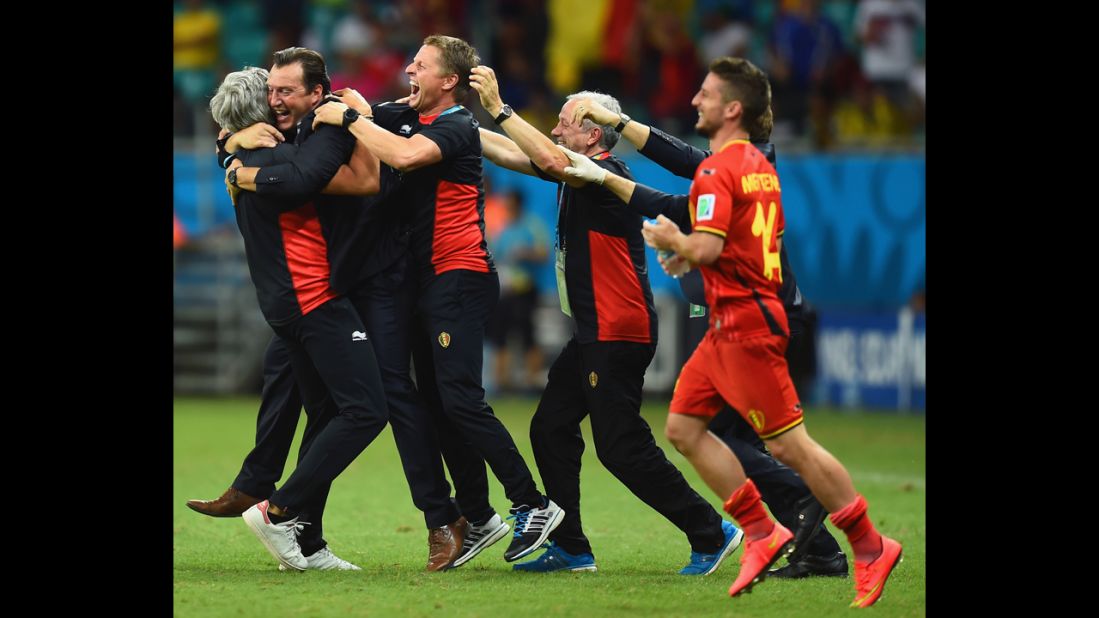 Head coach Marc Wilmots of Belgium, second from left, celebrates after defeating the United States.