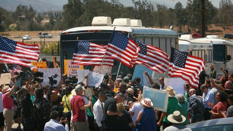 Angry protesters forced three buses carrying undocumented immigrants to turn around Tuesday in Southern California.