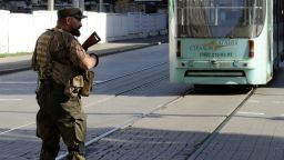 A pro-Russian militant stops the tram traffic as he takes part in the storm of the regional police station in the centre of the eastern Ukrainian city of Donetsk on July 1, 2014. Ukrainian tanks and fighter bombers on July 1 launched a ferocious assault against pro-Russian separatist insurgents after rejecting European attempts to save a tenuous 10-day truce. AFP PHOTO/ ALEXANDER KHUDOTEPLYAlexander KHUDOTEPLY/AFP/Getty Images