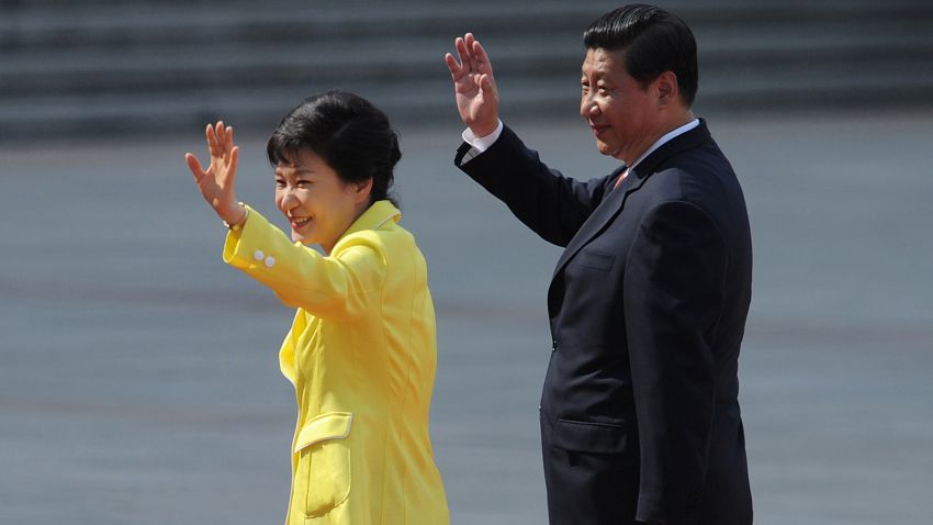 In this Thursday, June 27, 2013 file photo, South Korean President Park Geun-hye, left, and her Chinese counterpart Xi Jinping wave during a welcoming ceremony outside the Great Hall of the People in Beijing. Xi Jinping's first visit to the Korean Peninsula as China's president is to Seoul, not Pyongyang, meaning that North Korea's best friend has snubbed it for its most bitter rival. A flurry of recent rocket and missile tests, the latest on Wednesday, has made the North's displeasure crystal clear. (AP Photo/Wang Zhao, Pool, File)