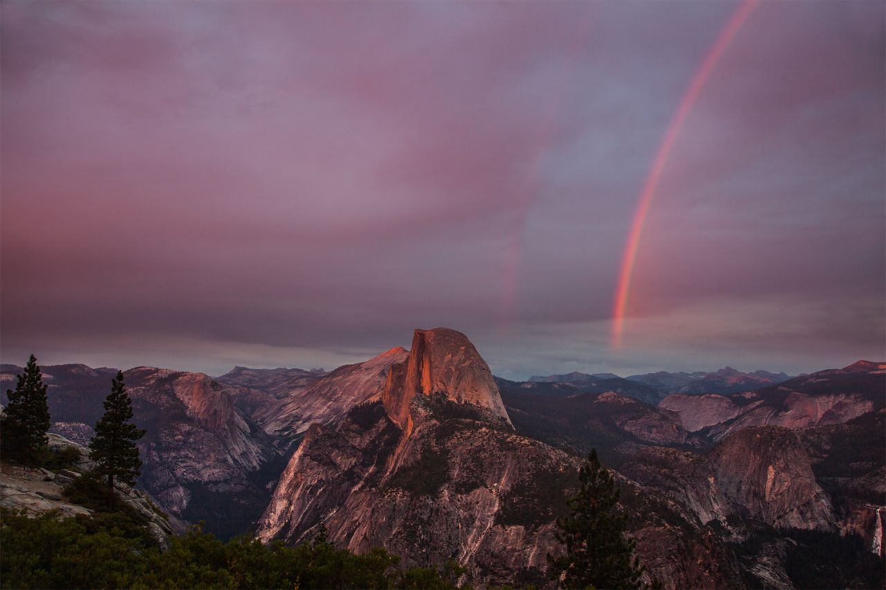 Yosemite National Park's Glacier Point overlook is <a href="http://ireport.cnn.com/docs/DOC-1004214">Aaron Keigher's</a> "favorite place in the world." It's not hard to see why when you look at this double rainbow beside the park's iconic Half Dome.