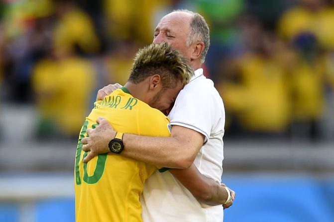 Brazil coach Luiz Felipe Scolari hugs Neymar after the team qualify for the quarter finals after that nervous penalty shoot out win over Chile. 