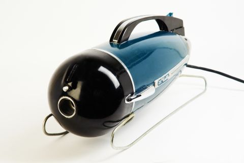 <strong>"Chaika" ("Seagull") Vacuum Cleaner, 1956</strong><br /><br />The idea of the space race was prevalent in the 1950s and many  new designs, like this rocket-shaped vacuum cleaner, were purposefully built to echo the space-ship aesthetic.<br /> <br />"It was an attempt to show the benefits of this new  technology to the population of the Soviet Union," said co-curator Alexandra Chiriac. "There was this idea that household appliances were like rockets for housewives."<br /> <br />"[The government] really tried to drive this point home, so that they wouldn't be accused of neglecting the population."