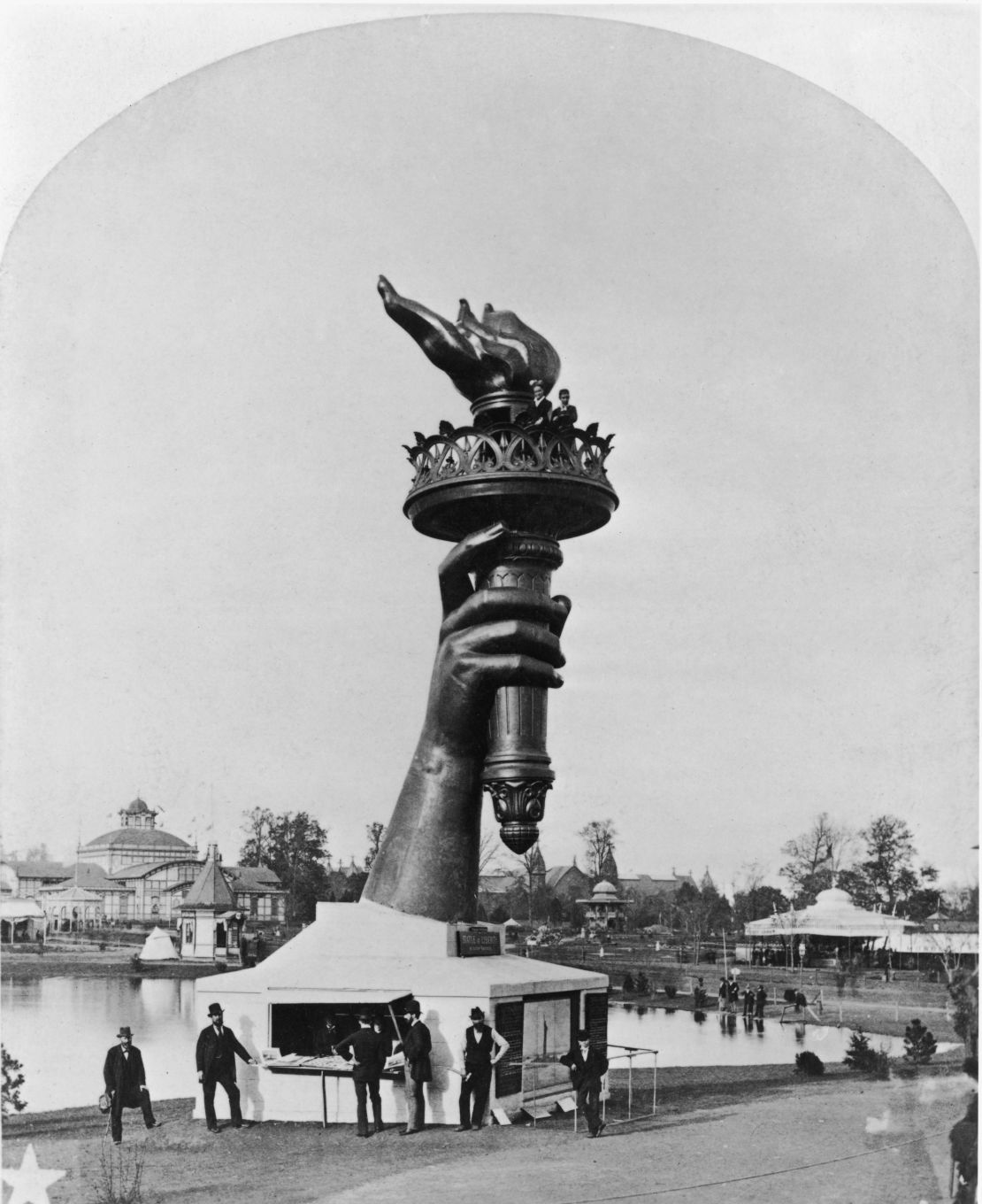 The forearm and torch of the Statue of Liberty on display at the Centennial Exposition in Philadelphia, 1876. To raise funds for the completion of the statue and its pedestal, members of the public could pay 50 cents to climb to the balcony of the torch.