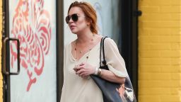 Lindsay Lohan takes a pre-birthday stroll in New York on Tuesday. The actress turned 28 on Wednesday, the day she filed suit. 