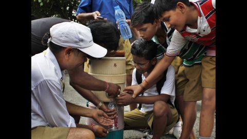Students fight to get water in New Delhi on June 15.