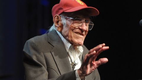 Zamperini, a University of Southern California alumnus, serves as a presenter at the Golden Goggle swimming awards in Los Angeles in 2011.