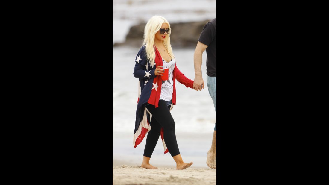 Christina Aguilera wraps herself in a more comfortable version of the U.S. flag for Independence Day 2012. 