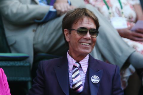 Pop singer and avid tennis fan Cliff Richard watches the Wimbledon action from the Royal Box.