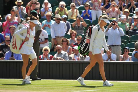 Bouchard and Halep arrive on Centre Court ahead of their match to the applause of the crowd.