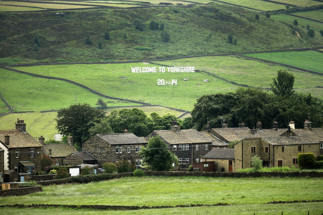 A sign welcoming the 2014 Tour de France adorns the countryside surrounding the Yorkshire village of Haworth where the famous literary Bronte sisters lived.