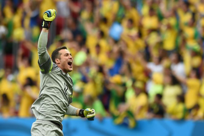 Cesar celebrates Neymar's first goal against Cameroon which would help ensure their qualification into the knockout stages of the World Cup and a thrilling encounter against Chile. 