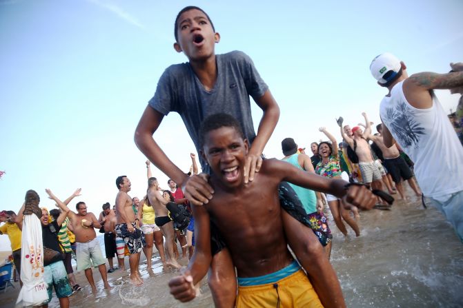 Brazilian fans celebrate on Copacabana beach after that nerve-wracking penalty shoot out win over Chile. 