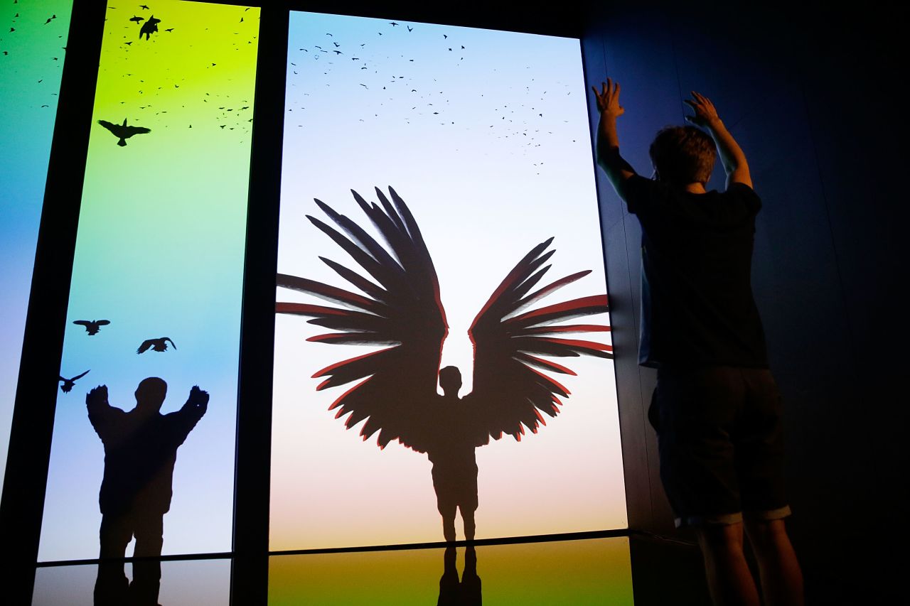 Participants take flight on virtual wings in immersive installation 'The Treachery of Sanctuary' on display at the Digital Revolution exhibition.  