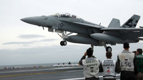 An F/A-18 Hornet is pictured aboard the USS George H.W. Bush on May 19, 2009. The F/A-18 Hornet, a late-'70s contemporary of the Air Force's F-16 Fighting Falcon, became the workhorse of U.S. carrier-based air power and still supplements the Navy's and Marines' more current fleet of F/A-18E and F/A-18F Super Hornets. It is designed as both a fighter and an attack aircraft.