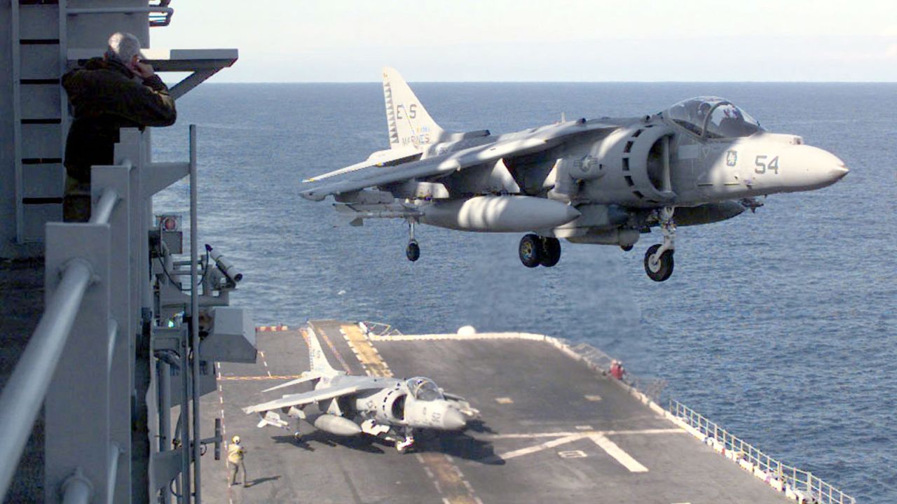 A AV-8B Harrier lands on board the USS Nassau on April 14, 1999, after a strike mission into Kosovo. The AV-8B Harrier is a single-engine ground-attack aircraft capable of vertical or short takeoff and landing. Though production of the aircraft ceased in 2003, the U.S. Marine Corps is looking at systems enhancements and plans to continue using Harriers well into the next decade.
