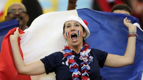 A France supporter cheers for her team.
