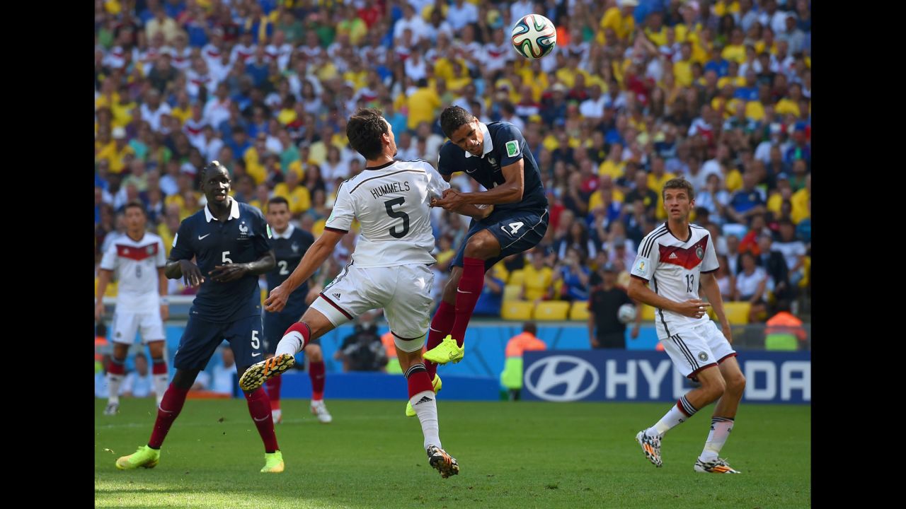Hummels fights off French defender Raphael Varane to score on his header.