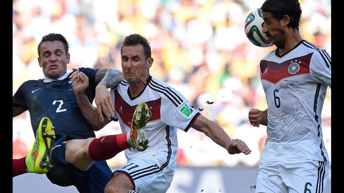 From left, French defender Mathieu Debuchy, Klose and Khedira compete for the ball.