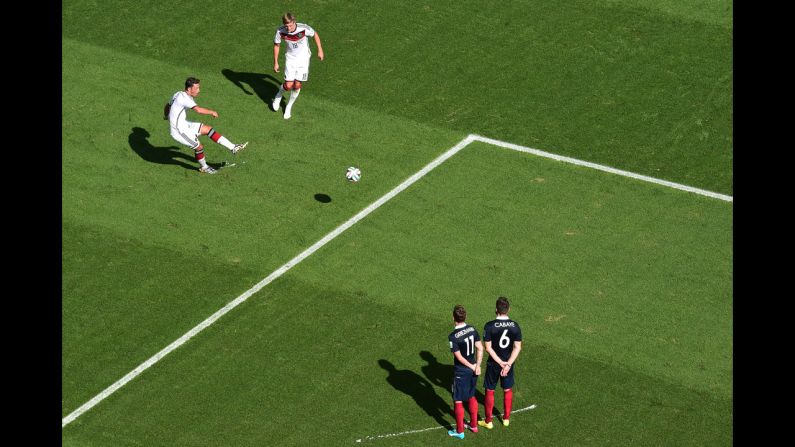 Germany's Mesut Oezil takes a free kick.