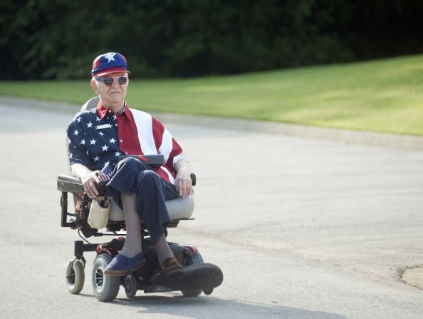 Walter Lindsay plays Whitney Houston's rendition of "The Star-Spangled Banner" during a golf-cart parade in Tyler, Texas.