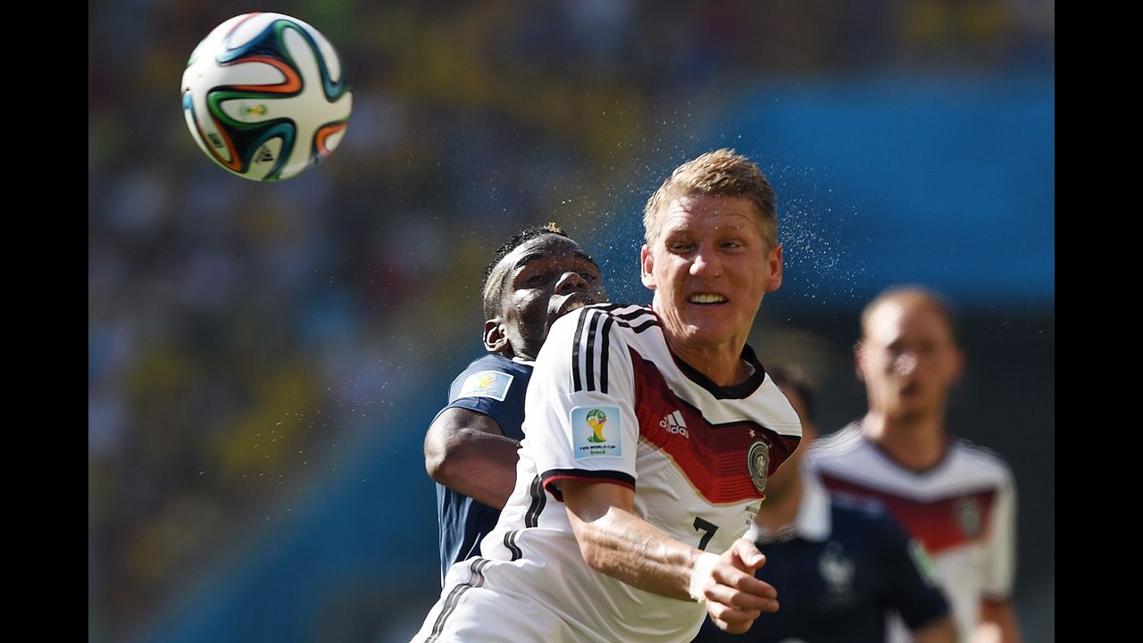 Schweinsteiger and French midfielder Paul Pogba compete for the ball.