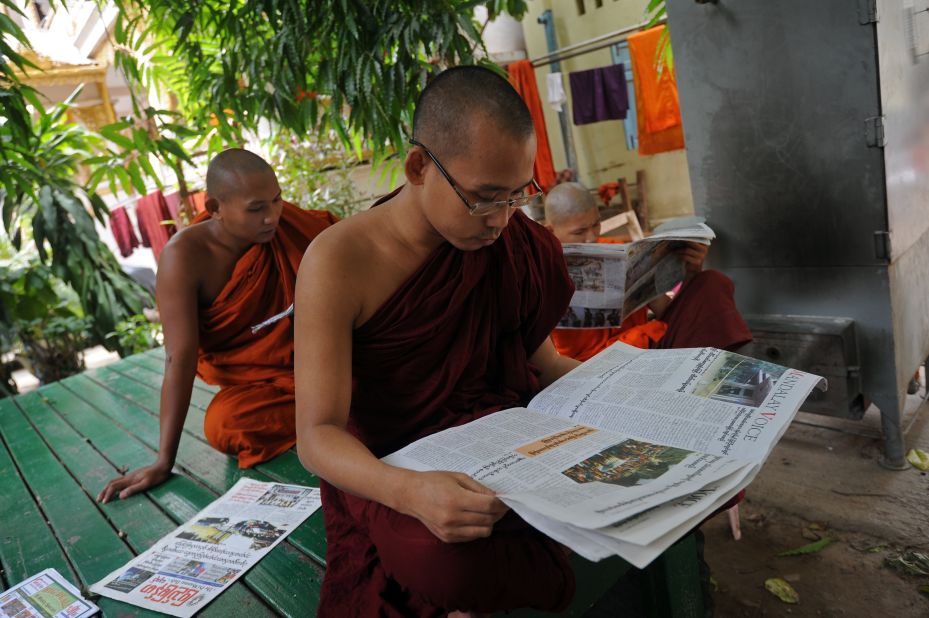 Buddhists monks read newspapers at a monastery in Mandalay. Radical Buddhist monks, including the nationalist 969 Movement's spiritual leader Ashin Wirathu, have been accused of helping to incite the violence.