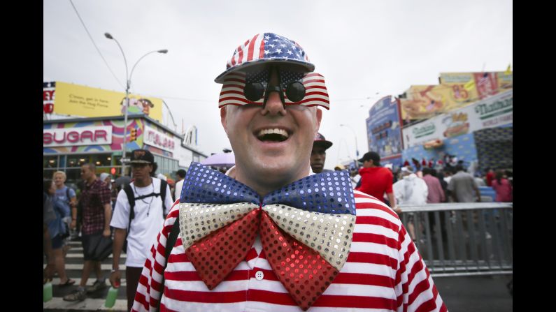 David Turner walks down Surf Avenue while wearing his American flag accessories.