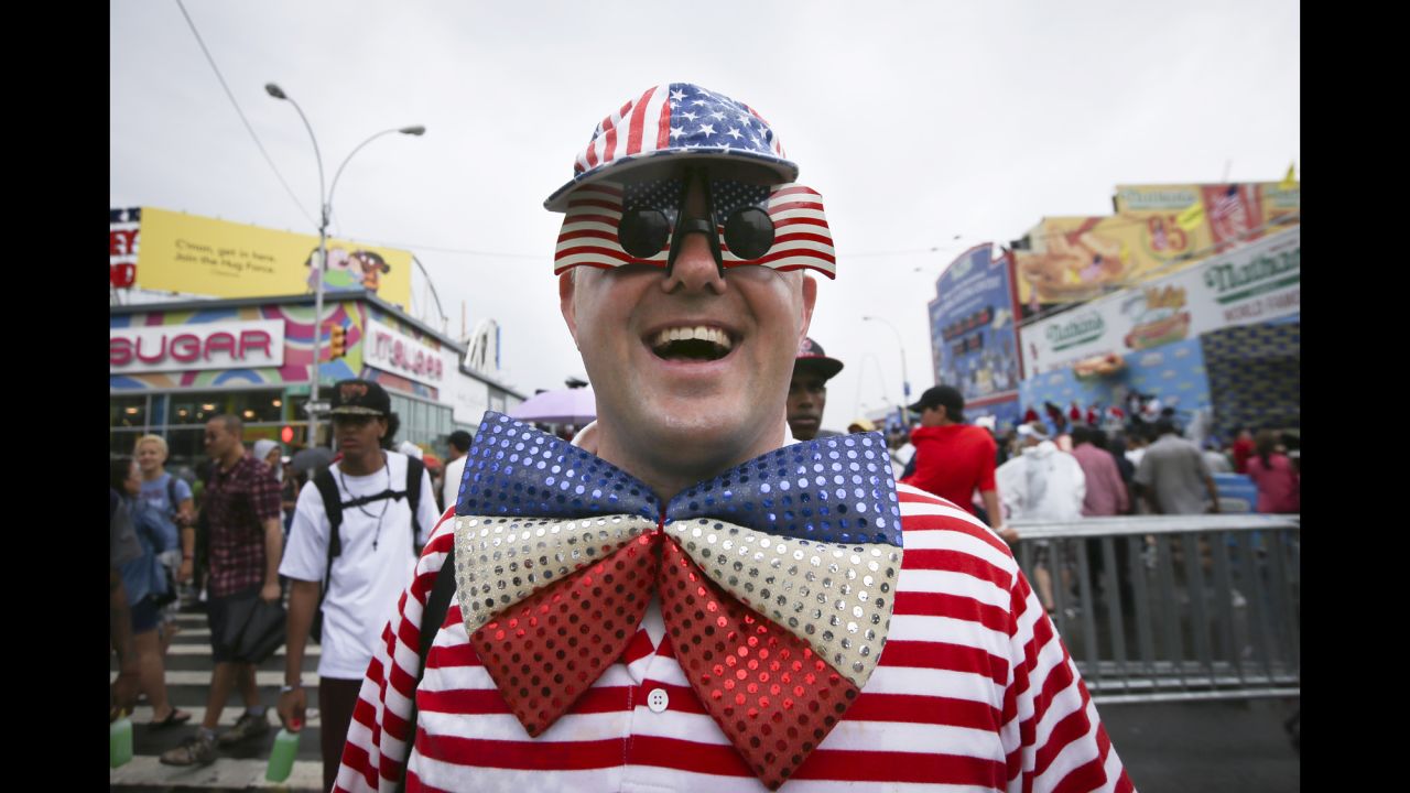 David Turner walks down Surf Avenue while wearing his American flag accessories.