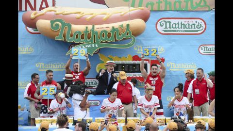 The women's competition was held earlier in the day. Miki Sudo, second from right, won by eating 34 hot dogs.