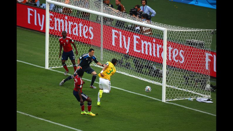 Brazil's captain, Thiago Silva, redirects a corner kick into the net to give his team a 1-0 lead over Colombia early in the first half.