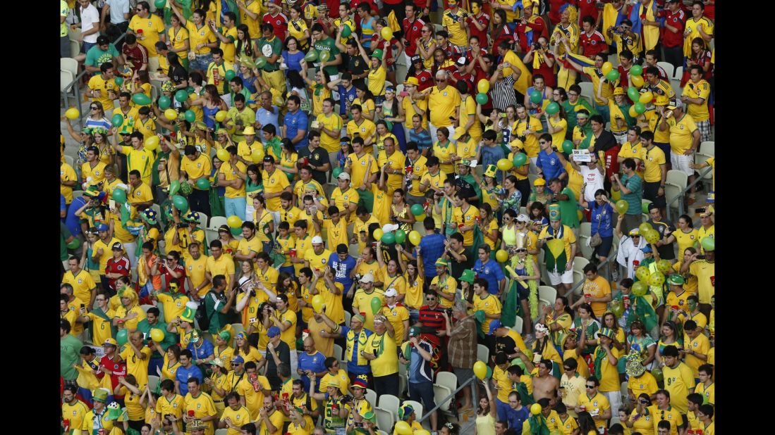 Brazil fans cheer their team. 