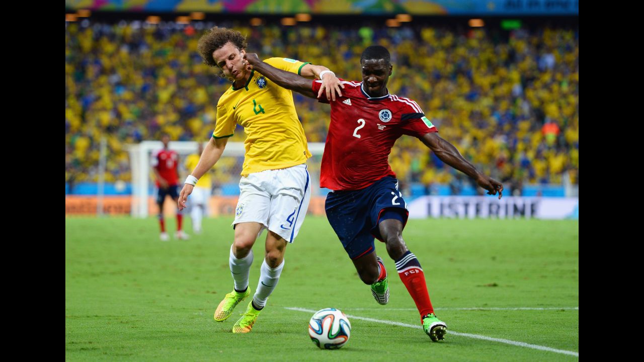 David Luiz, left, and Colombia's Cristian Zapata compete for the ball. 