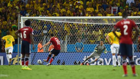 Colombia's James Rodriguez scores a second-half penalty against Brazil during a World Cup quarterfinal match Friday, July 4, in Fortaleza, Brazil. But Brazil held on to win 2-1 and advance to the semifinals.