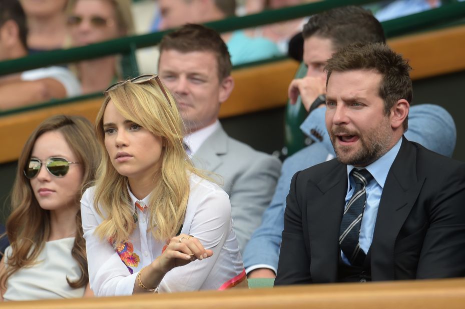Not quite so Royal but not quite so unimpressed. Bradley Cooper watches on with his girlfriend, British model Suki Waterhouse. 