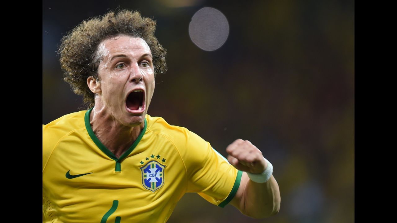 Brazilian defender David Luiz celebrates after he scored on a long-range free kick to give his team a 2-0 lead over Colombia. 