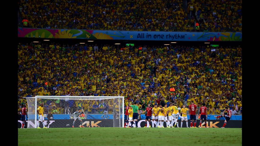 Colombia's James Rodriguez takes a free kick. 
