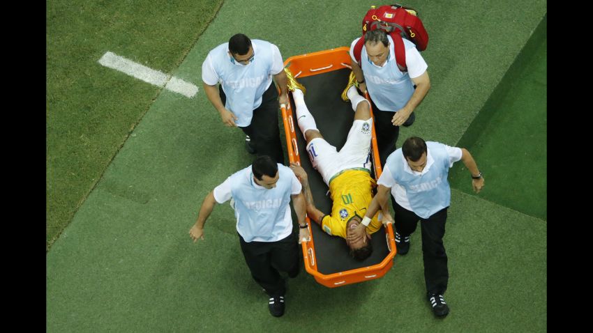 Brazil's forward Neymar is carried on a stretcher after being injured during the quarter-final football match between Brazil and Colombia at the Castelao Stadium in Fortaleza during the 2014 FIFA World Cup on July 4, 2014.