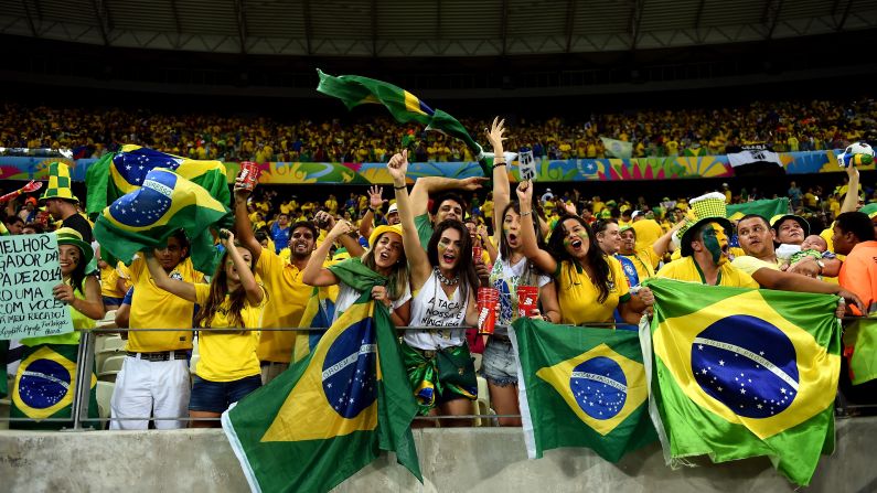 Brazil fans cheer during the quarterfinal match between Brazil and Colombia on Friday, July 4, in Fortaleza, Brazil. 