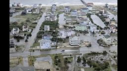 This Friday, July 4, 2014 aerial photo provided by the U.S. Coast Guard shows flooding caused by Hurricane Arthur on the Outer Banks of North Carolina. Arthur struck North Carolina as a Category 2 storm with winds of 100 mph late Thursday, taking about five hours to move across the far eastern part of the state. (AP Photo/ )