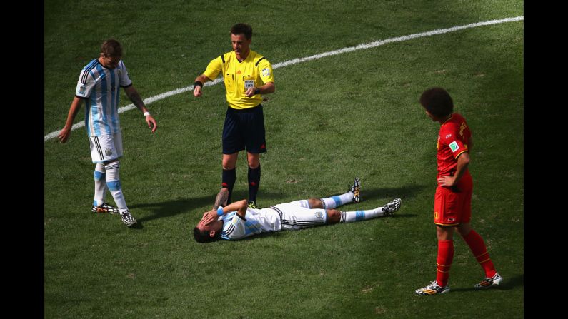 Angel di Maria of Argentina lies on the pitch.