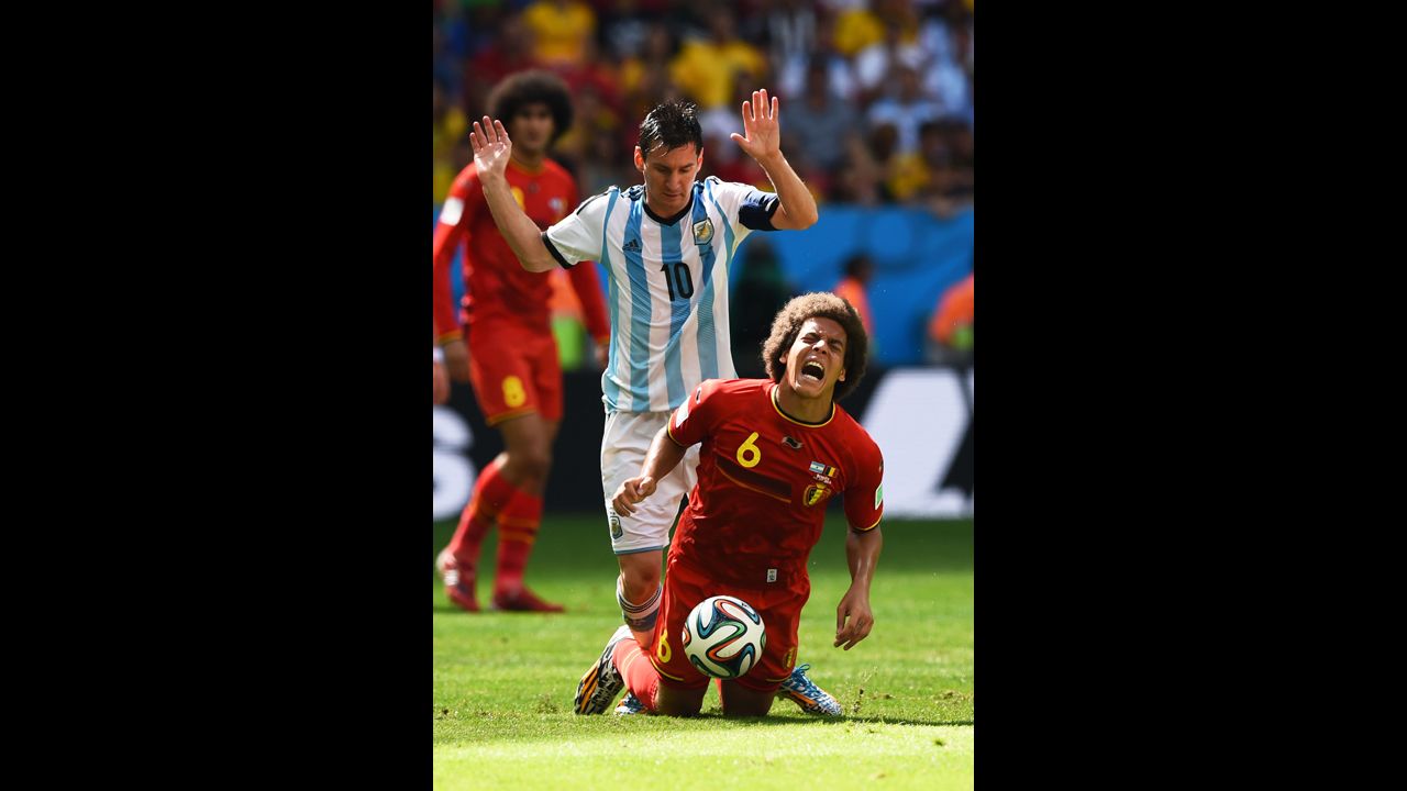 Argentina's Messi challenges Axel Witsel of Belgium.