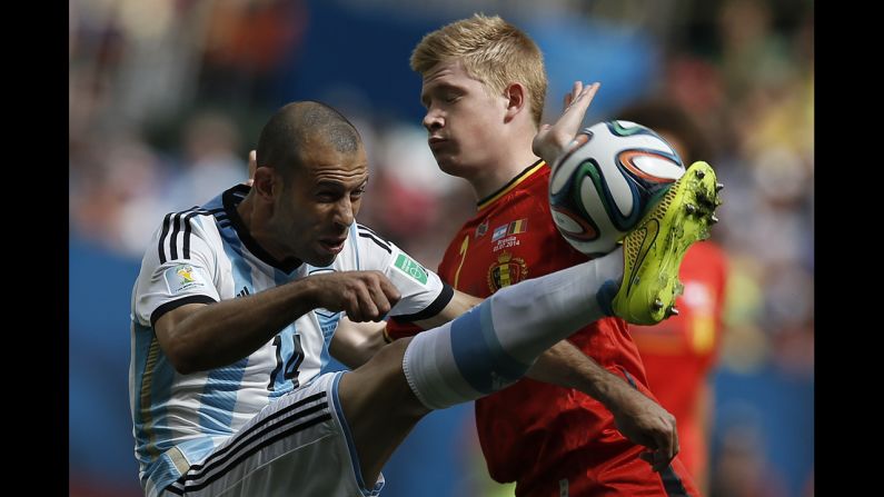 Argentina midfielder Javier Mascherano, left, vies with Belgium's Kevin De Bruyne.