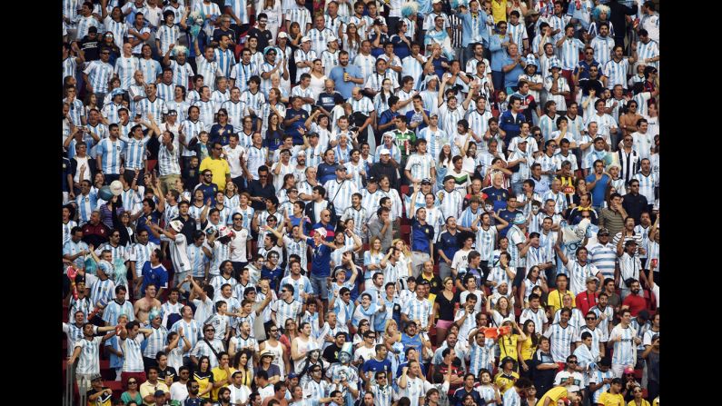 Argentina fans cheer during the match against Belgium at the Mané Garrincha National Stadium.
