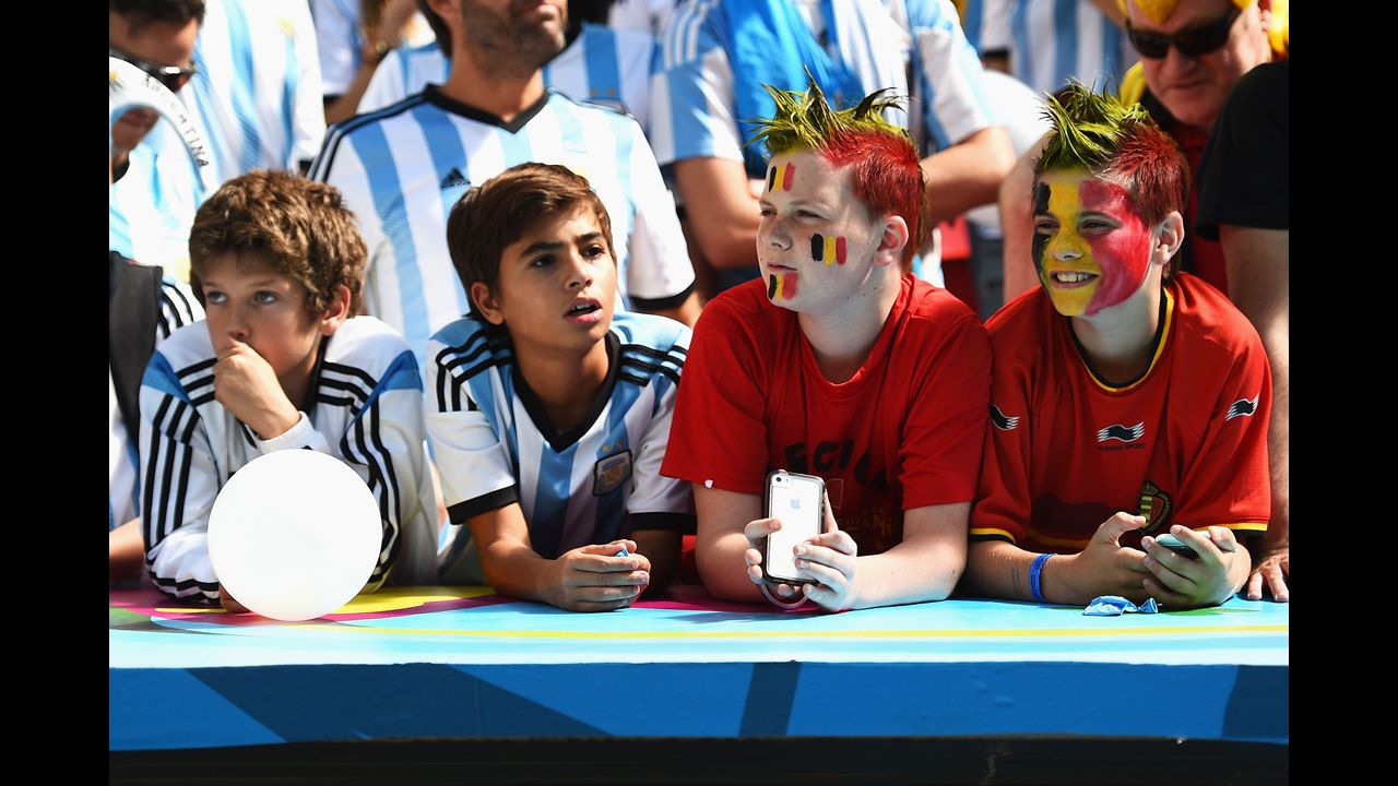 Young fans of both Argentina and Belgium cheer prior to the match.